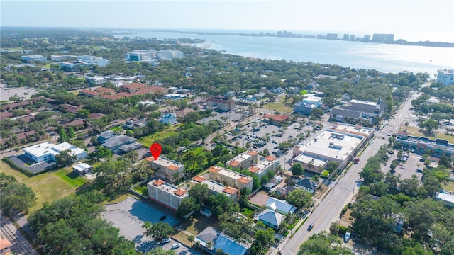 birds eye view of property with a view of city and a water view