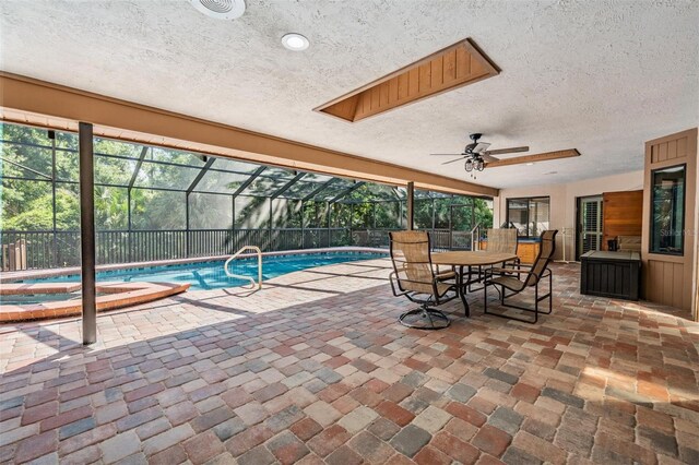 663 Turnberry Ct, Tarpon Springs, FL 34688 - view of pool featuring a patio, a fenced in pool, a ceiling fan, glass enclosure, and a hot tub