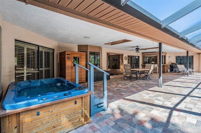 663 Turnberry Ct, Tarpon Springs, FL 34688 - view of patio featuring outdoor dining area, ceiling fan, and a hot tub