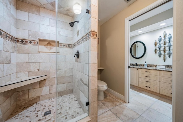 663 Turnberry Ct, Tarpon Springs, FL 34688 - bathroom featuring toilet, baseboards, a shower stall, and vanity