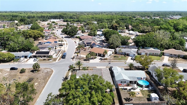 aerial view of residential area with a heavily wooded area