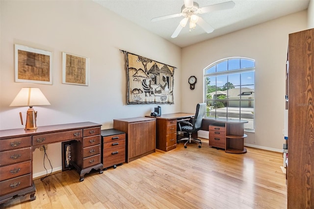 office area with ceiling fan, baseboards, and light wood-style floors