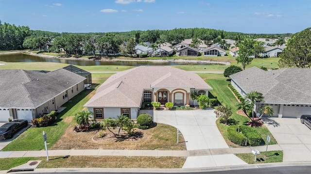 aerial view with a residential view and a water view
