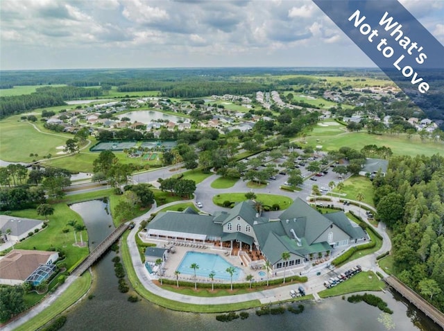 birds eye view of property with a water view and golf course view