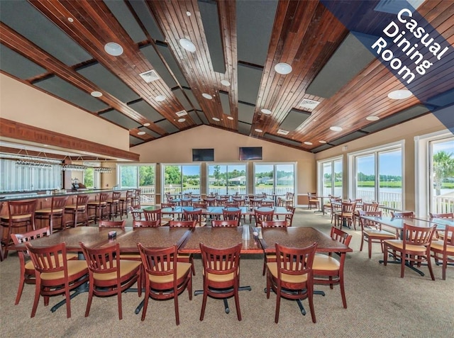 carpeted dining area featuring wood ceiling, a community bar, vaulted ceiling, and visible vents