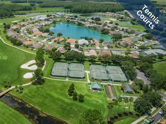 drone / aerial view featuring a water view and a residential view