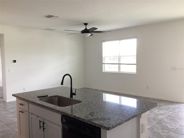 12630 Aston Dr, Hudson, FL 34669 - kitchen with a sink, an island with sink, dark stone countertops, black dishwasher, and visible vents