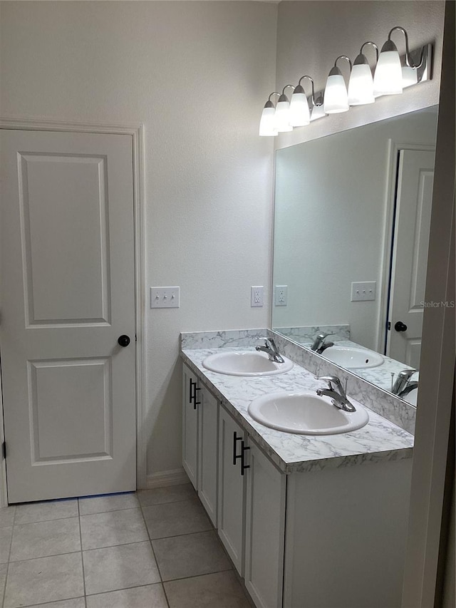 12630 Aston Dr, Hudson, FL 34669 - bathroom featuring double vanity, a sink, and tile patterned floors