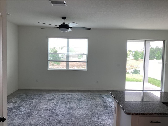 12630 Aston Dr, Hudson, FL 34669 - interior space with ceiling fan, visible vents, plenty of natural light, and baseboards