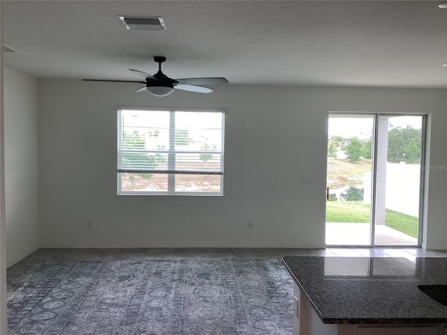 12630 Aston Dr, Hudson, FL 34669 - spare room with visible vents, a ceiling fan, and baseboards