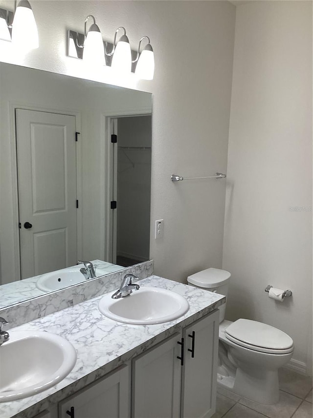 12630 Aston Dr, Hudson, FL 34669 - full bath featuring tile patterned flooring, a sink, and toilet