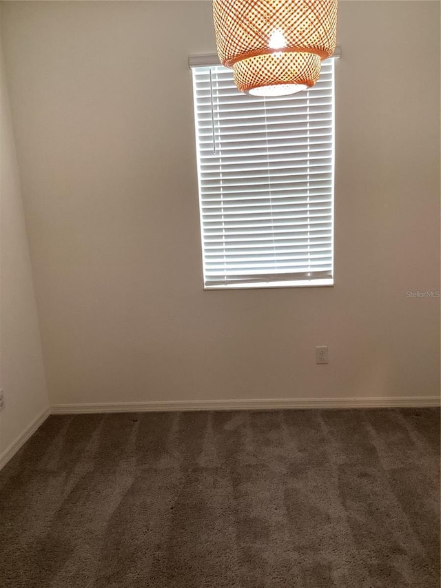 12630 Aston Dr, Hudson, FL 34669 - unfurnished room with baseboards and carpet