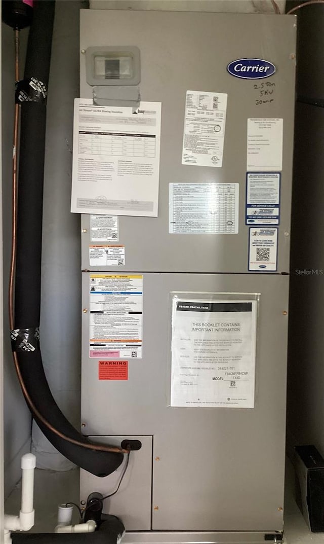 12630 Aston Dr, Hudson, FL 34669 - utility room with heating unit