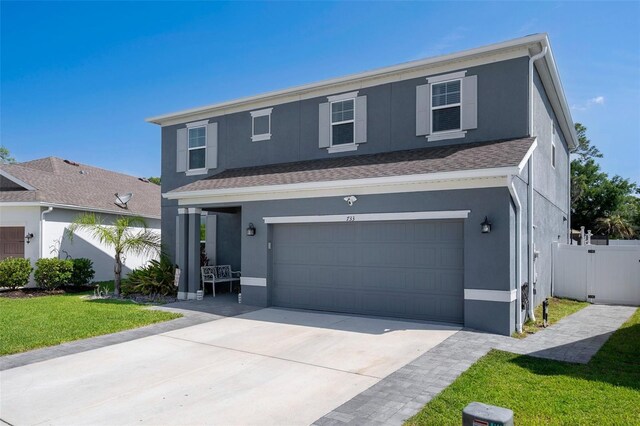 733 Old Windsor Way, Spring Hill, FL 34609 - traditional home featuring fence, an attached garage, a front lawn, stucco siding, and concrete driveway