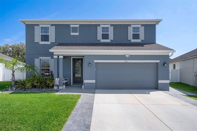 733 Old Windsor Way, Spring Hill, FL 34609 - traditional-style house with fence, an attached garage, stucco siding, a front yard, and driveway