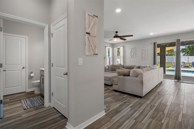 733 Old Windsor Way, Spring Hill, FL 34609 - living area featuring ceiling fan, plenty of natural light, and wood finished floors