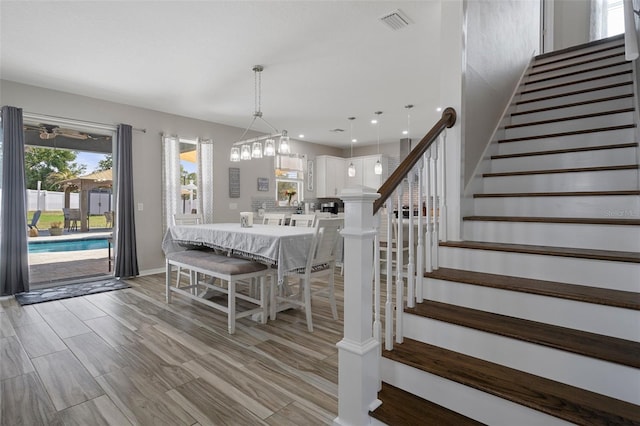 733 Old Windsor Way, Spring Hill, FL 34609 - dining space with visible vents, light wood-type flooring, stairs, baseboards, and recessed lighting