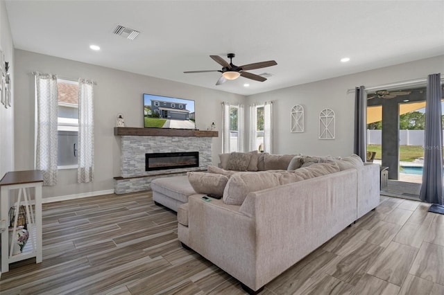 733 Old Windsor Way, Spring Hill, FL 34609 - living area with ceiling fan, visible vents, a healthy amount of sunlight, and wood finished floors