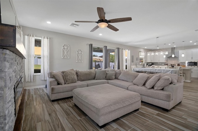 733 Old Windsor Way, Spring Hill, FL 34609 - living area with ceiling fan, recessed lighting, a wealth of natural light, wood finished floors, and visible vents
