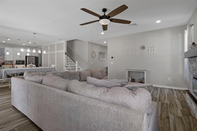 733 Old Windsor Way, Spring Hill, FL 34609 - living room featuring ceiling fan, visible vents, a fireplace, stairs, and recessed lighting