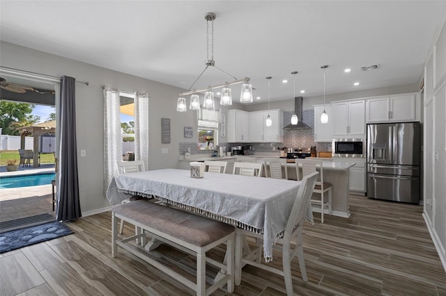 733 Old Windsor Way, Spring Hill, FL 34609 - dining space with recessed lighting, plenty of natural light, dark wood-style floors, and visible vents