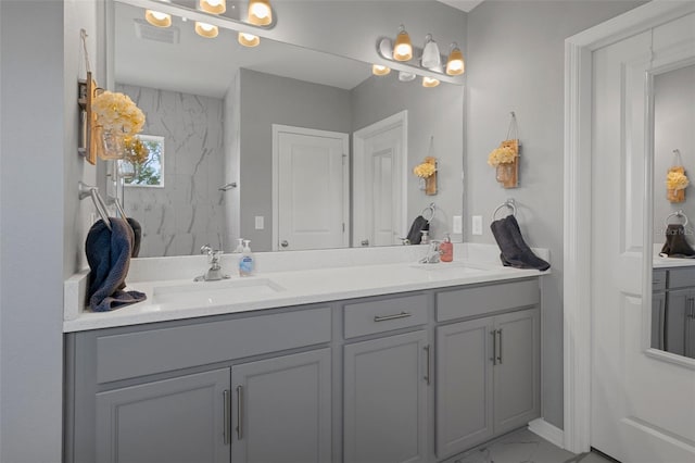 733 Old Windsor Way, Spring Hill, FL 34609 - bathroom with double vanity, a sink, marble finish floor, and visible vents