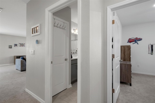 733 Old Windsor Way, Spring Hill, FL 34609 - corridor featuring baseboards and light colored carpet