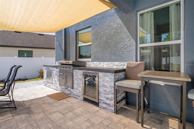 733 Old Windsor Way, Spring Hill, FL 34609 - view of patio / terrace with beverage cooler, fence, and area for grilling