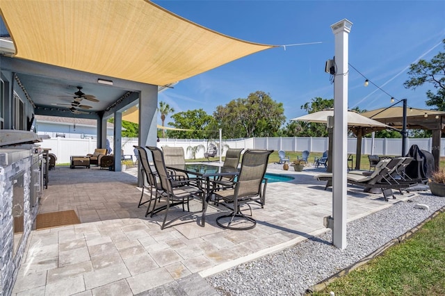 733 Old Windsor Way, Spring Hill, FL 34609 - view of patio featuring a fenced in pool, a fenced backyard, a ceiling fan, and outdoor dining space
