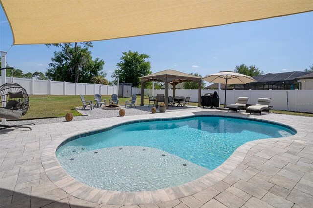 733 Old Windsor Way, Spring Hill, FL 34609 - view of pool featuring a storage shed, a fenced backyard, a patio area, a lawn, and a fire pit