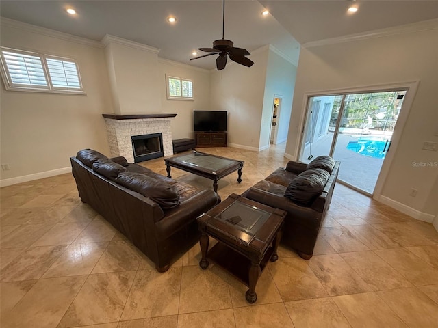 210 S Hale Ave, Tampa, FL 33609 - living room featuring crown molding, baseboards, ceiling fan, a fireplace, and recessed lighting