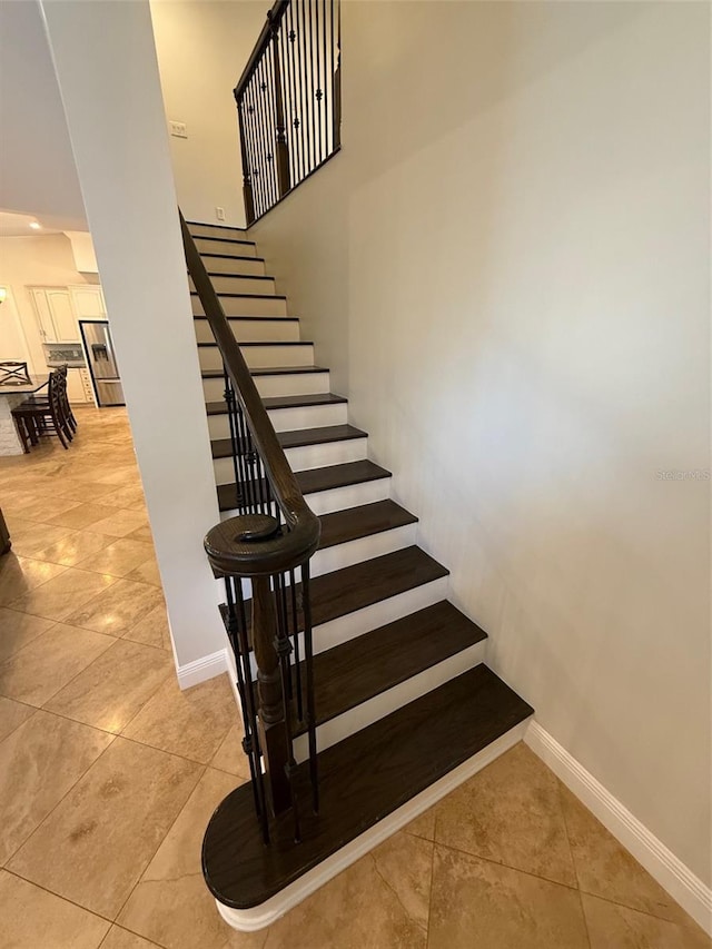 210 S Hale Ave, Tampa, FL 33609 - stairs featuring baseboards and tile patterned flooring