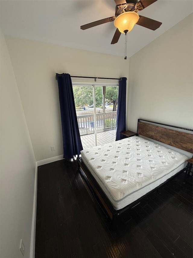 210 S Hale Ave, Tampa, FL 33609 - bedroom featuring access to exterior, dark wood-style flooring, baseboards, and ceiling fan