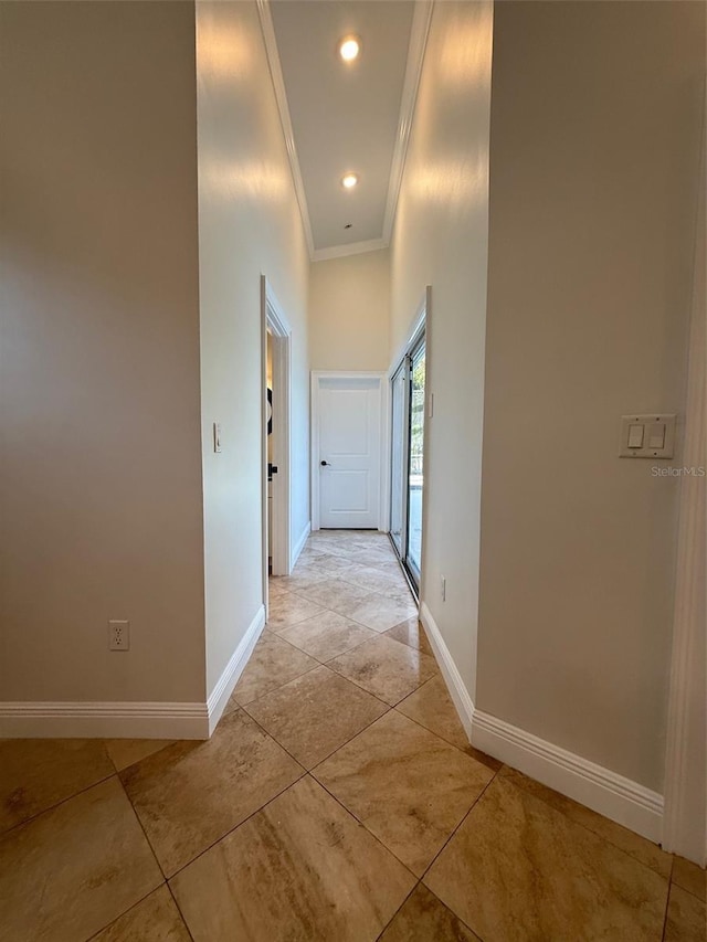 210 S Hale Ave, Tampa, FL 33609 - hall featuring crown molding, baseboards, a high ceiling, light tile patterned floors, and recessed lighting