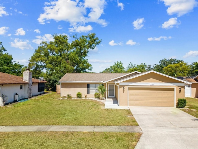 single story home featuring an attached garage, a front lawn, stucco siding, and driveway