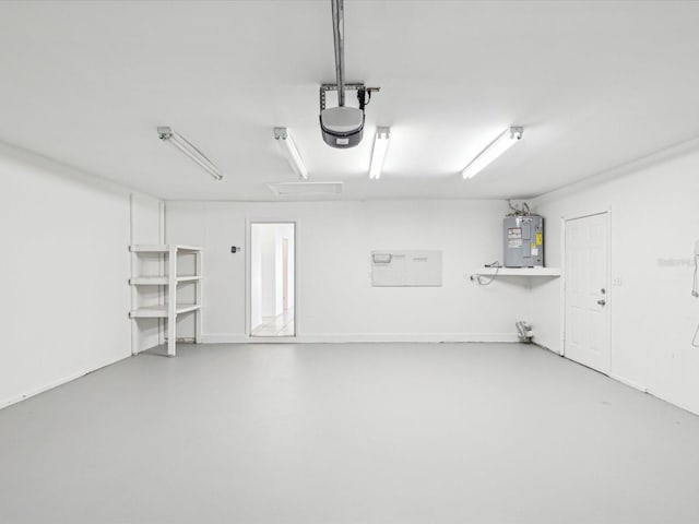 garage with a garage door opener and water heater