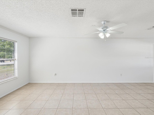 spare room with visible vents, a textured ceiling, and ceiling fan