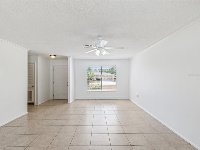 spare room with visible vents, crown molding, light tile patterned flooring, a textured ceiling, and a ceiling fan