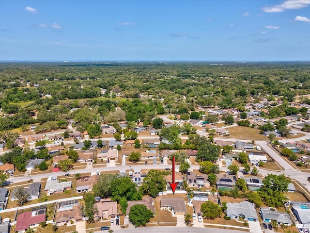 birds eye view of property with a residential view and a forest view
