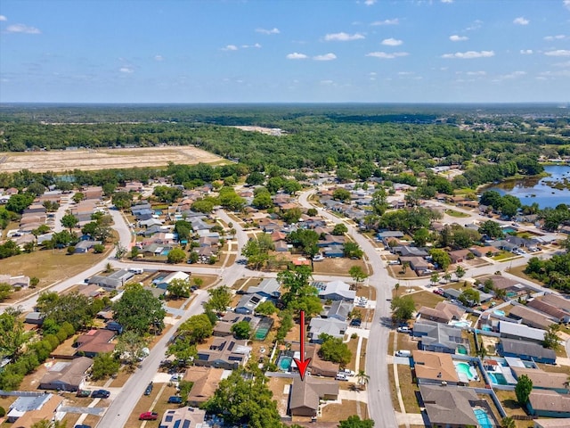 drone / aerial view featuring a water view and a residential view