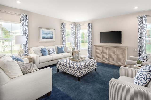 carpeted living area with recessed lighting and baseboards