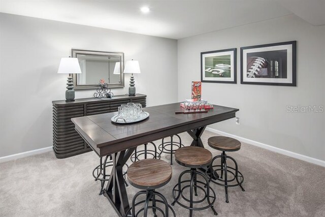 office space with light colored carpet and baseboards