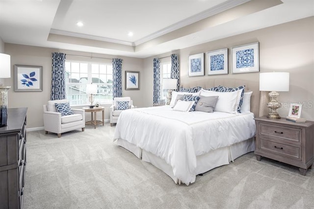 bedroom with crown molding, baseboards, light colored carpet, recessed lighting, and a tray ceiling