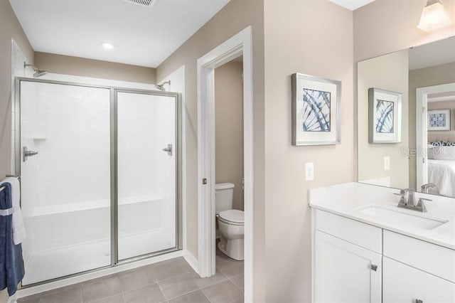 ensuite bathroom with toilet, tile patterned floors, ensuite bath, and a stall shower