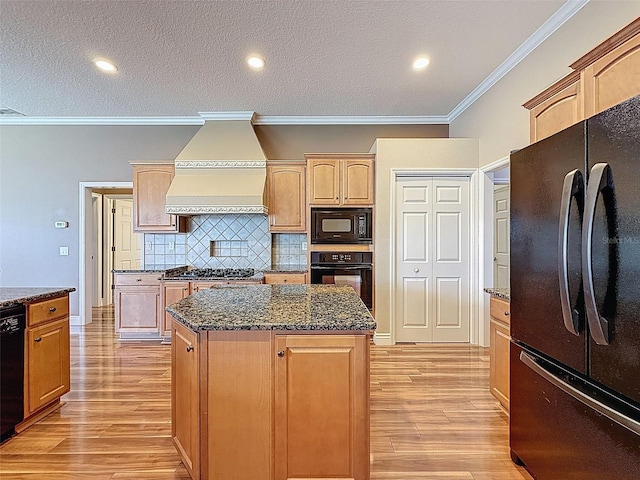 3464 Misty View Dr, Spring Hill, FL 34609 - kitchen featuring black appliances, custom exhaust hood, crown molding, light wood finished floors, and backsplash