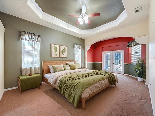 3464 Misty View Dr, Spring Hill, FL 34609 - bedroom featuring french doors, carpet flooring, access to exterior, and a raised ceiling