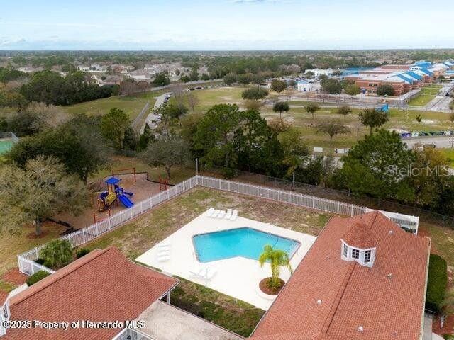 3464 Misty View Dr, Spring Hill, FL 34609 - community pool featuring a fenced backyard and a patio area