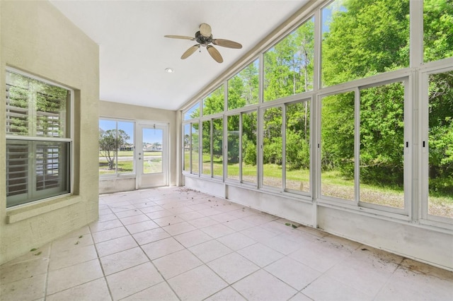 unfurnished sunroom featuring ceiling fan