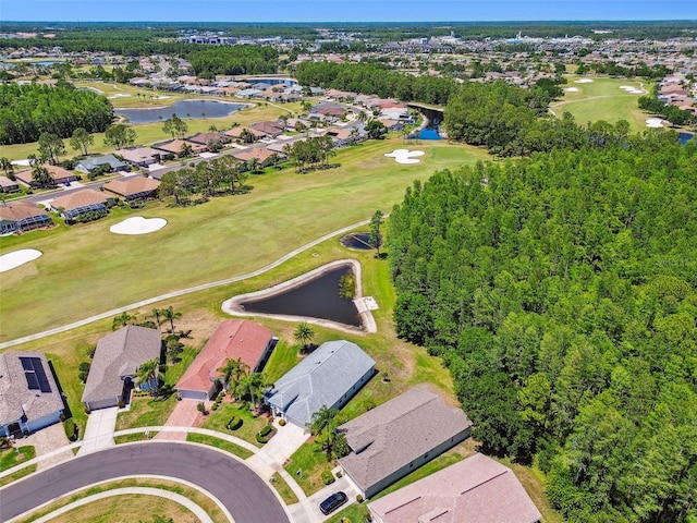 aerial view with a water view, view of golf course, and a residential view