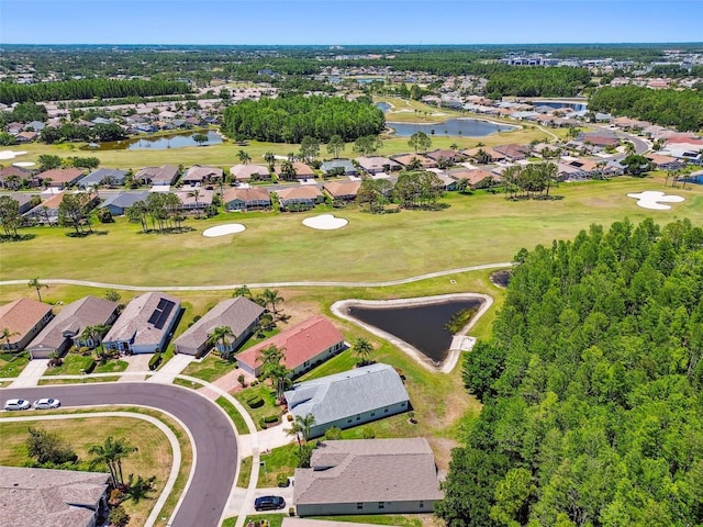 aerial view featuring a water view, golf course view, and a residential view